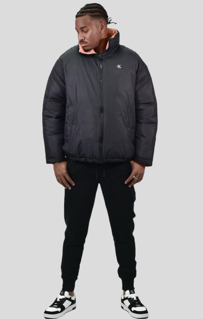 Reversible and Modern Elegance: Down Jacket, Cargo Jogger and Bi-Material Sneakers in Black by Calvin Klein