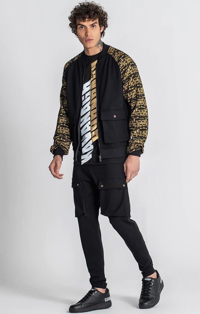 VICE style: Bomber jacket, Dual T-shirt, cargo shorts and street slippers from Gianni Kavanagh in black
